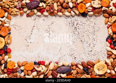 Frame made of various nuts and dried fruits, copy space. Stock Photo