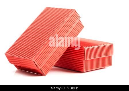 Two red closed corrugated cardboard boxes isolated on white. Valentine's Day gift box packaging concept Stock Photo