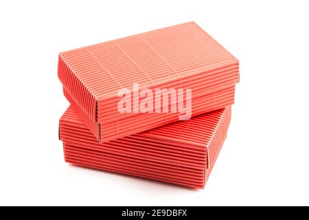 Two red closed corrugated cardboard boxes isolated on white. Valentine's Day gift box packaging concept Stock Photo