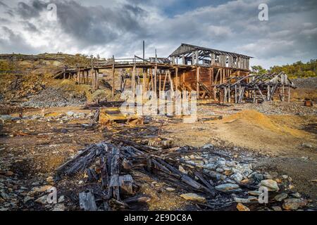 Wooden ruined building of old copper mine Christianus Sextus Gruve near Roros in Norway. Abandoned mining grounds. Stock Photo