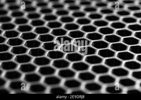 Black honeycomb membrane structure, macro photo with selective soft focus. Hight-tech background texture Stock Photo