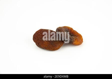 Naturally sun dried apricots isolated on white background. Stock Photo