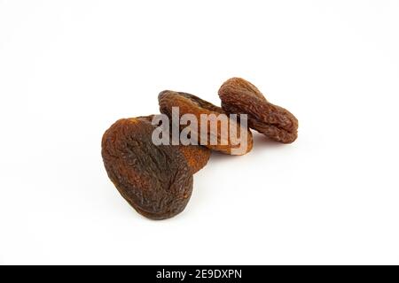 Naturally sun dried apricots isolated on white background. Stock Photo