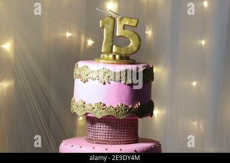 Pink party cake, 15th birthday, with golden number fifteen, pink cake, 15 year old birthday cake Stock Photo