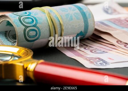 Magnifying Glass on the Russian Currency Rubles Stock Photo