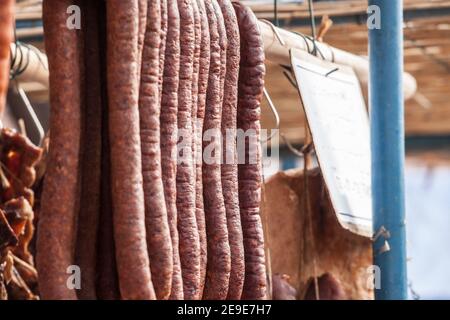 Serbian Kulen Kobasica sausage, handmade, hanging and drying in the coutryside of Serbia. Kulen is a traditional pork sausage, dry and cured, from Cro Stock Photo