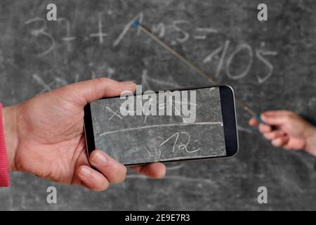 recording of an online lesson in school,homeschooling,online learning due to corona lockdown, symbolic picture Stock Photo
