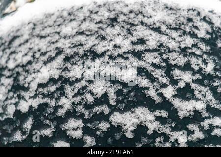 Selective focus. Snow flakes on black background abstract texture Stock Photo