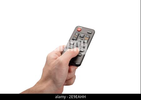 Online tv media control. man hand with modern remote control isolated on white background. remote control from an online media box in a man's hand. di Stock Photo