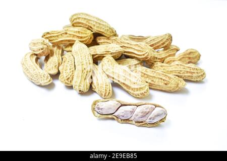 boiled peanuts with peel on white background Stock Photo