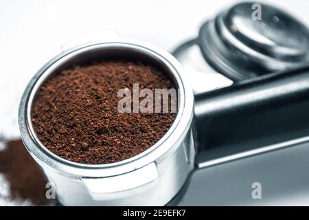 Espresso holder and replaceable coffee filters. The horn from the coffee machine on a white  Stock Photo