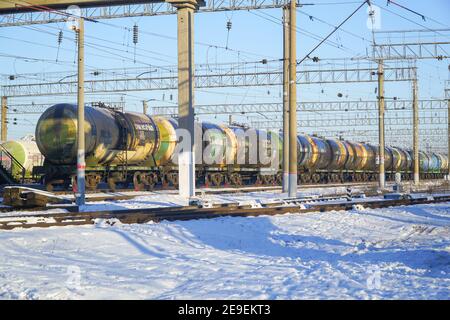 Chapaevsk, Samara region, Russia - December 08, 2020: Railway tanks at the station against the blue sky Stock Photo