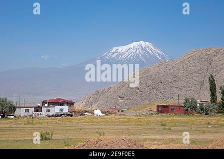 Turkish farm and Mount Ararat / Greater Ararat, snow-capped and dormant  polygenic, compound stratovolcano / volcano in the extreme east of Turkey Stock Photo