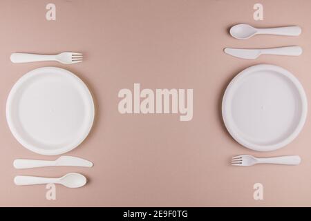 a table setting in a restaurant for two persons with a plate spoon fork knife Stock Photo