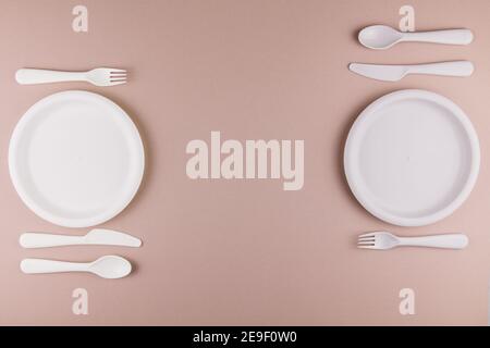 a table setting in a restaurant for two persons with a plate spoon fork knife Stock Photo