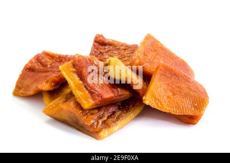 dried papaya pieces on white background Stock Photo