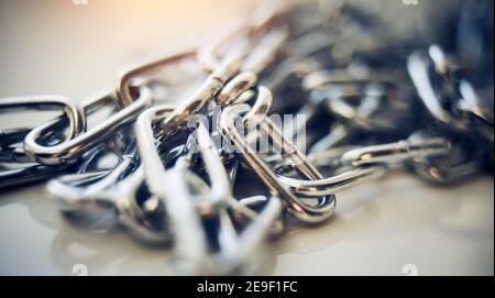 Close-up of a shiny metal chain. Chain links. Stock Photo