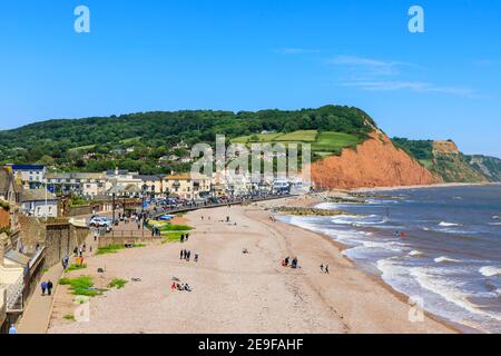 View looking east to Salcombe Hill over the sea, beach and coastline of Sidmouth, a popular south coast seaside town in Devon, south-west England Stock Photo