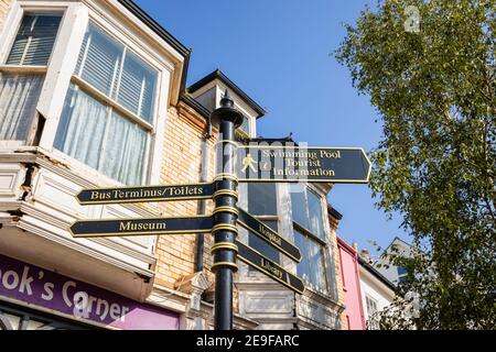 Information signpost pointing to local attractions, amenities and places of interest in Sidmouth, a coastal town in Devon on the Jurassic Coast Stock Photo