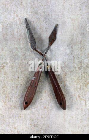 Vertical closeup shot of two palette knives for painting Stock Photo