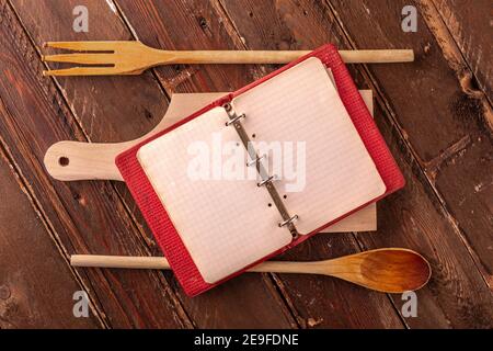 Vintage Empty Cookbook on Wooden Table with Cutting Board Stock Photo