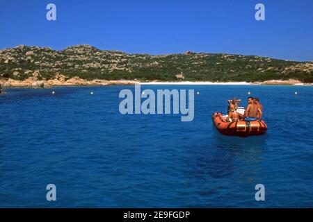 La Maddalena archipelago, Sardinia, Italy. Tourist's boat in front of Pink Beach, Budelli Island (scanned from  colorslide) Stock Photo