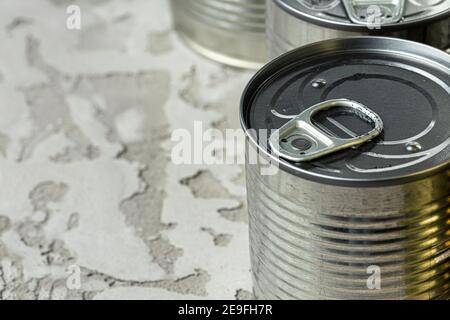many cans with meals such as meat and fish on the table, conserved food Stock Photo