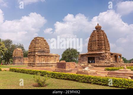 Bagalakote, Karnataka, India - November 7, 2013: Pattadakal temple complex. Brown stone tall tower of Galaganatha temple and double Jambulingeshwara T Stock Photo