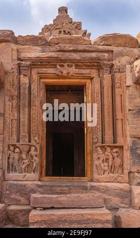 Bagalakote, Karnataka, India - November 7, 2013: Pattadakal temple complex. Extensive sculptures around Entrance doorway into brown stone Jambulingesh Stock Photo