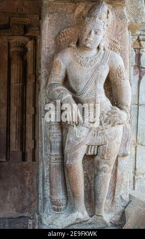 Bagalakote, Karnataka, India - November 7, 2013: Pattadakal temple complex. Closeup of gray stone statue of dwarapalaka at entrance to Virupaksha temp Stock Photo