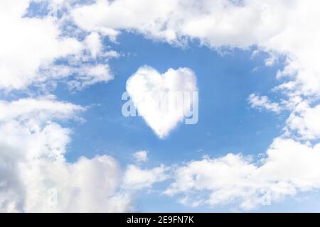 Heart on the sky with cloudy. Blue sky with hearts shape clouds natural background. love concept. Stock Photo