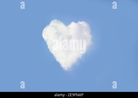 Heart on the sky with cloudy. Blue sky with hearts shape clouds natural background. Stock Photo