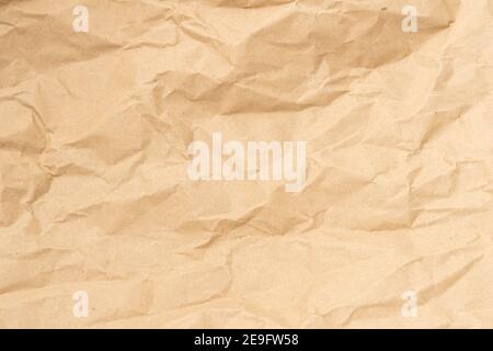 Crumpled brown paper texture perfect for background structure. Packaging material with rough wrinkles. The grunge textured surface is vintage Stock Photo