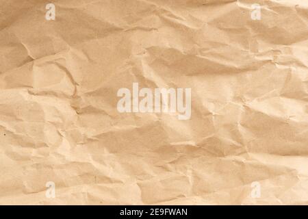 Crumpled brown paper texture perfect for background structure. Packaging material with rough wrinkles. The grunge textured surface is vintage Stock Photo