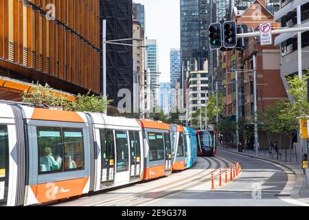 Sydney city centre summers day CBD light rail train tram on George Street passing the EY centre building,Sydney,Australia Stock Photo