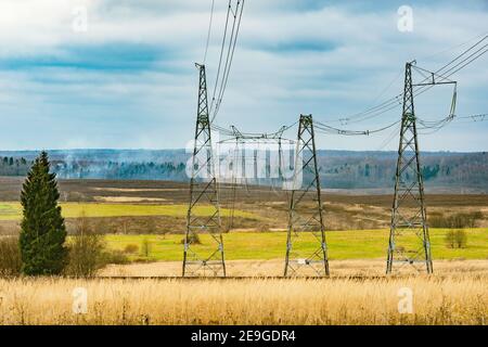 High voltage towers on cloudy sky background before thunderstorm Stock ...