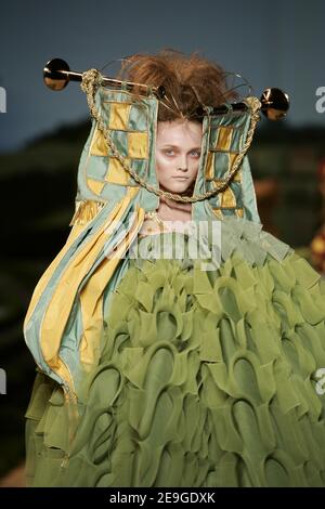 a-model-displays-a-creation-by a-model-displays-a-creation-by