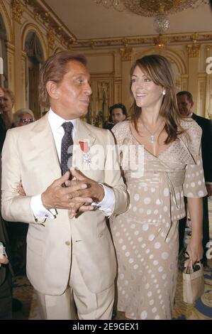 Italian fashion designer Valentino flanked actress Liz Hurley has been honored by French Culture minister Renaud Donnedieu de Vabres with the medal of 'Chevalier de la Legion d'Honneur' in Paris, France, on July 6, 2006. Photo by Giancarlo Gorassini/ABACAPRESS.COM Stock Photo