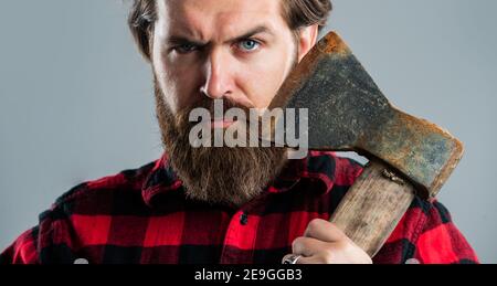 Making hair look magical. barbershop and hairdresser. brutal guy with long beard. brutal mature hipster wear checkered shirt. casual and denim trends. handsome man. male charisma and brutality. Stock Photo
