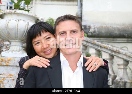 EXCLUSIVE : French President Jacques Chirac's adoptive daughter, Anh Dao Traxel and her husband Emmanuel Traxel pose during the 'Foret des Livres' writers meeting at Chanceaux Pres Loches, France, organized by french author Gonzague Saint-Bris on August 27, 2006 Photo by Denis Guignebourg/ABACAPRESS.COM Stock Photo