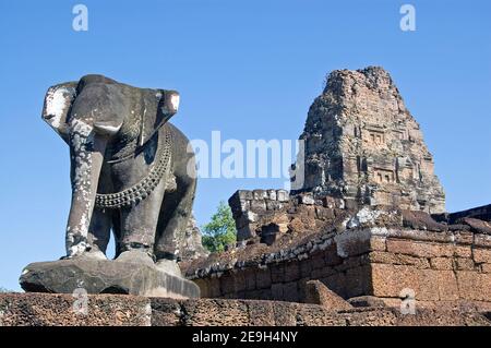 View of the ancient Khmer temple of East Mebon, part of the Angkor complex at Siem Reap, Cambodia. Large elephant statues are mounted on the corners w Stock Photo
