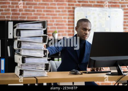 Digital Transformation. Accountant Using E Invoice Tax Document Software Stock Photo