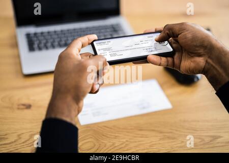 Remote Check Deposit Using Mobile Remote. Taking Photo Stock Photo