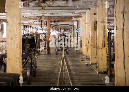 Long view inside the ropery at the Historic Dockyard / Dockyards Chatham in Kent. The ropewalk at Chatham Dockyard (as part of the Ropery or Ropehouse) is still producing rope commercially after several hundred years. England UK (121) Stock Photo