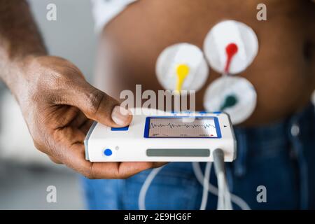 African American Patient Using Electrodes Diagnostic Device Stock Photo