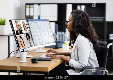 Online Virtual Learning Conference. Working On Multiple Screens Stock Photo