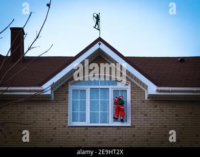 big toy Santa Claus gets in window