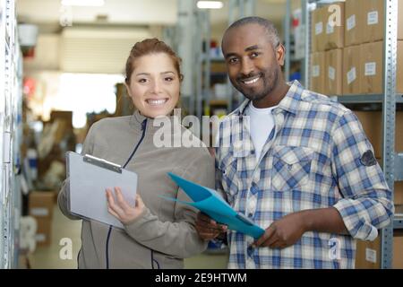 woman and man engineers in warehouse Stock Photo