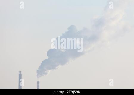 Air Pollution in the City . Steam of industrial smoke comes from the pipes Stock Photo