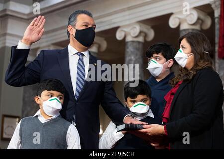 Washington, DC, USA. 04th Feb, 2021. Democratic Senator from California Alex Padilla (Back L), participates in a ceremonial swearing-in with members of his family (L to R); son Diego Padilla (age 6), son Alex Padilla (age 7), son Roman Flores (age 13), and spouse Angela Padilla (R), in the Old Senate Chamber on Capitol Hill in Washington, DC, USA, 04 February 2021.Credit: Michael Reynolds/Pool via CNP | usage worldwide Credit: dpa/Alamy Live News Stock Photo